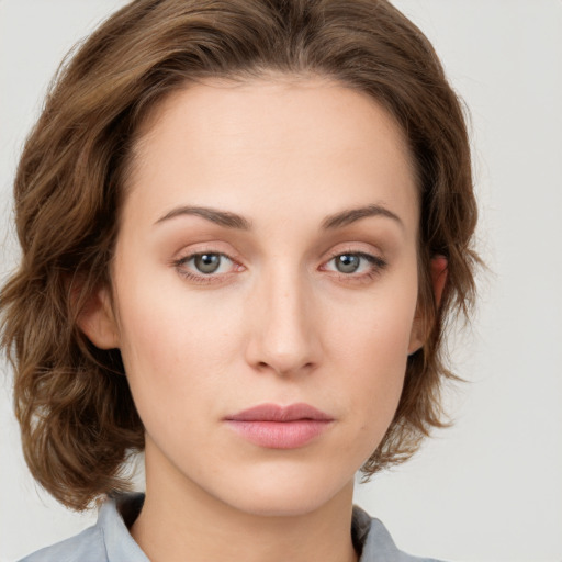 Neutral white young-adult female with medium  brown hair and green eyes