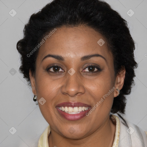 Joyful latino adult female with short  brown hair and brown eyes