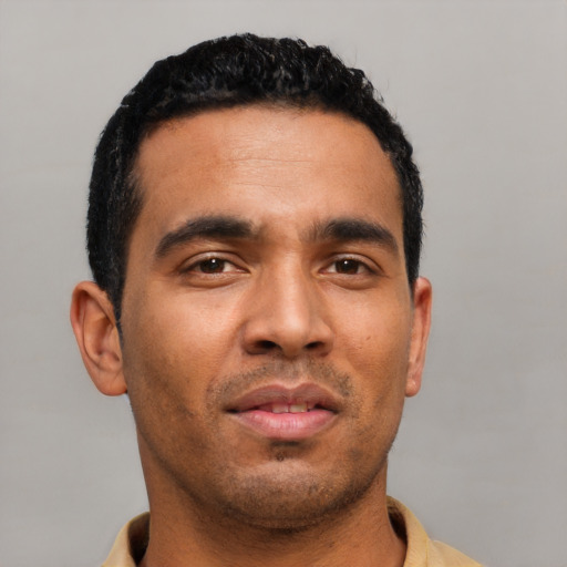 Neutral latino young-adult male with short  black hair and brown eyes