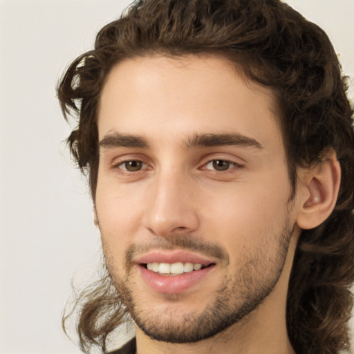 Joyful white young-adult male with medium  brown hair and brown eyes