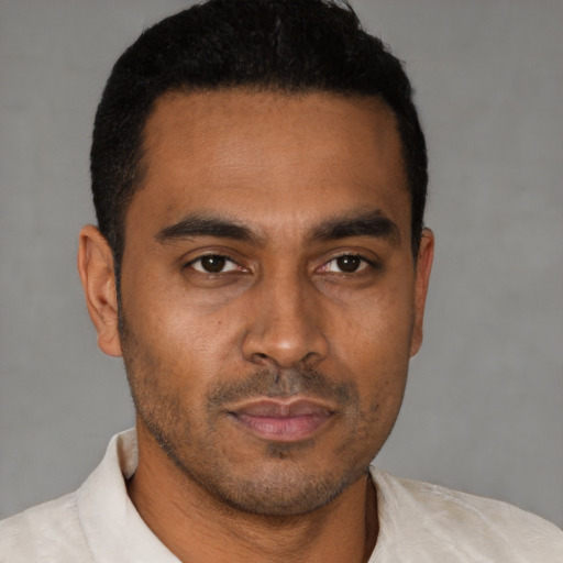 Neutral latino young-adult male with short  brown hair and brown eyes