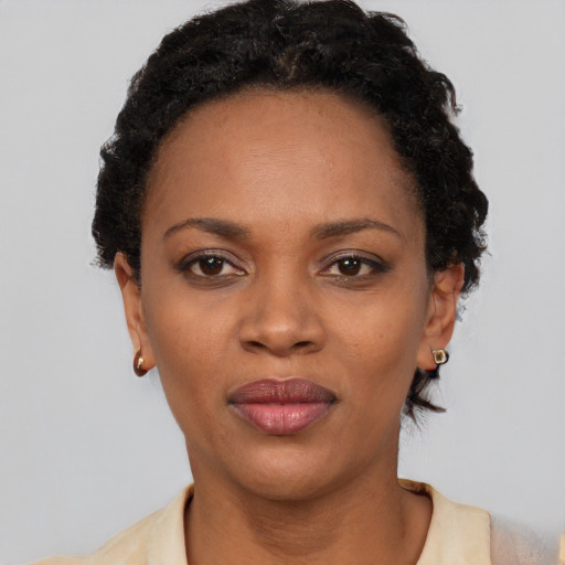 Neutral black adult female with short  black hair and brown eyes