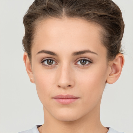 Neutral white young-adult female with short  brown hair and brown eyes