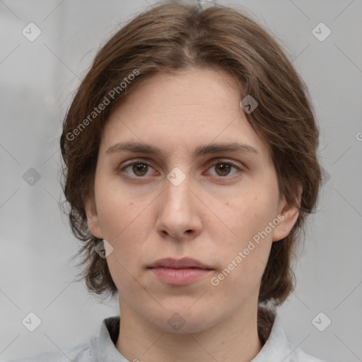 Neutral white young-adult female with medium  brown hair and brown eyes