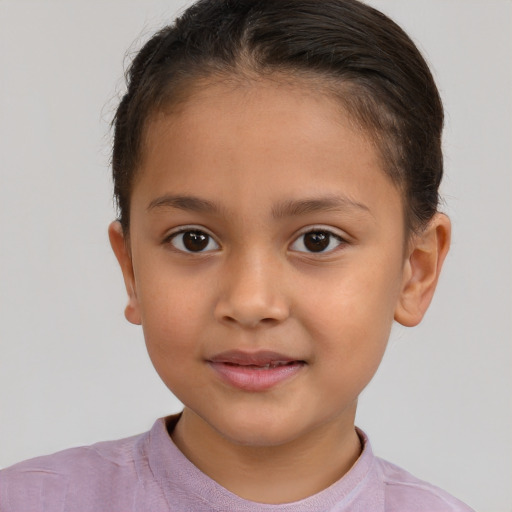 Joyful white child female with short  brown hair and brown eyes