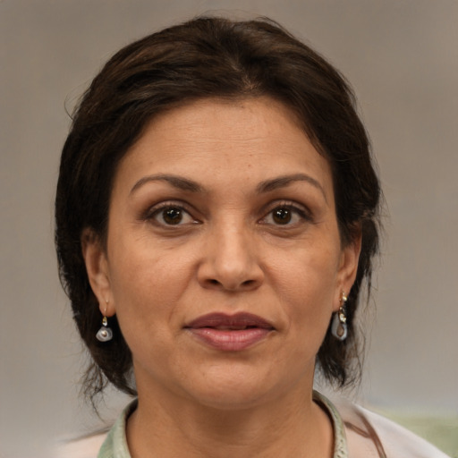 Joyful white adult female with medium  brown hair and brown eyes
