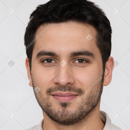 Joyful white young-adult male with short  black hair and brown eyes