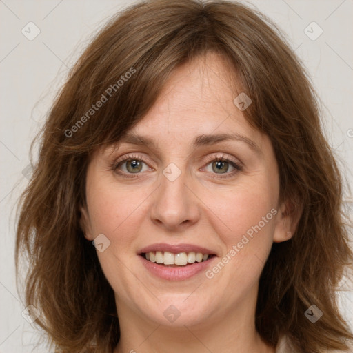 Joyful white adult female with medium  brown hair and green eyes