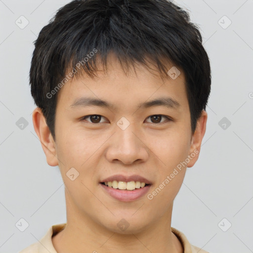 Joyful asian young-adult male with short  brown hair and brown eyes