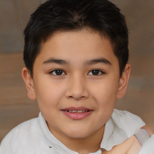 Joyful white child male with short  brown hair and brown eyes