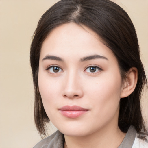 Neutral white young-adult female with medium  brown hair and brown eyes