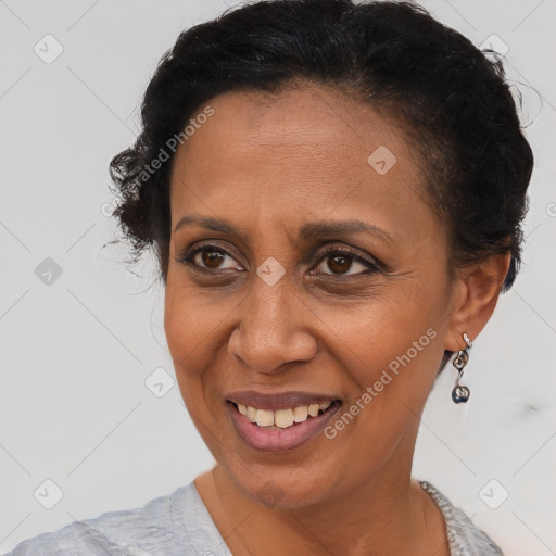 Joyful latino adult female with short  brown hair and brown eyes