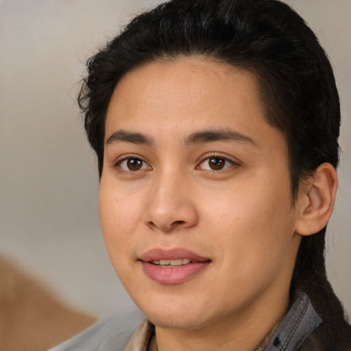 Joyful latino young-adult female with medium  brown hair and brown eyes