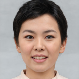 Joyful asian young-adult female with short  brown hair and brown eyes