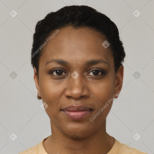 Joyful black young-adult female with short  black hair and brown eyes