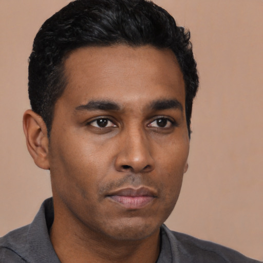 Neutral black young-adult male with short  black hair and brown eyes