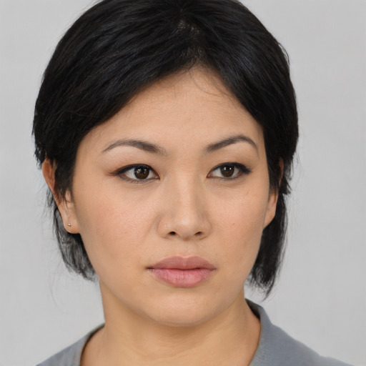 Neutral asian young-adult female with medium  black hair and brown eyes