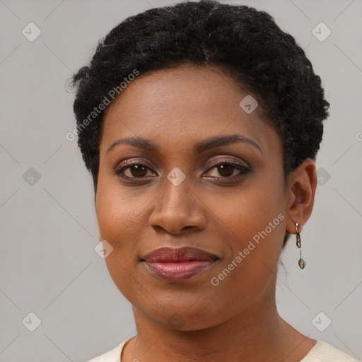 Joyful black young-adult female with short  brown hair and brown eyes