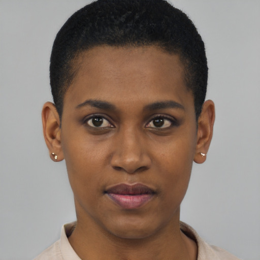 Joyful black young-adult female with short  black hair and brown eyes