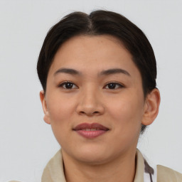 Joyful asian young-adult female with medium  brown hair and brown eyes