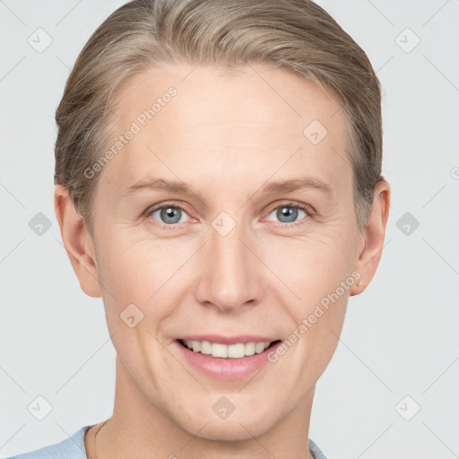 Joyful white adult female with short  brown hair and grey eyes