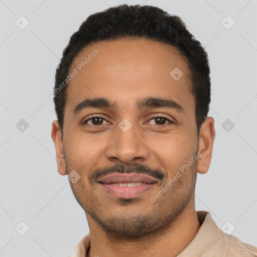 Joyful latino young-adult male with short  black hair and brown eyes