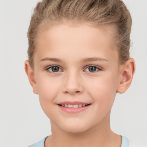 Joyful white child female with short  brown hair and brown eyes