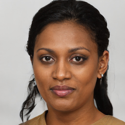 Joyful black young-adult female with medium  black hair and brown eyes