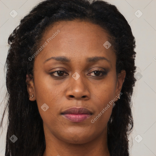 Joyful black young-adult female with long  brown hair and brown eyes