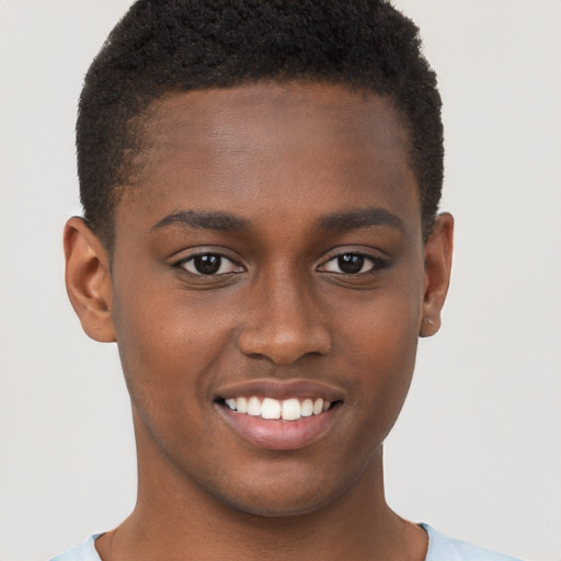 Joyful black young-adult male with short  brown hair and brown eyes