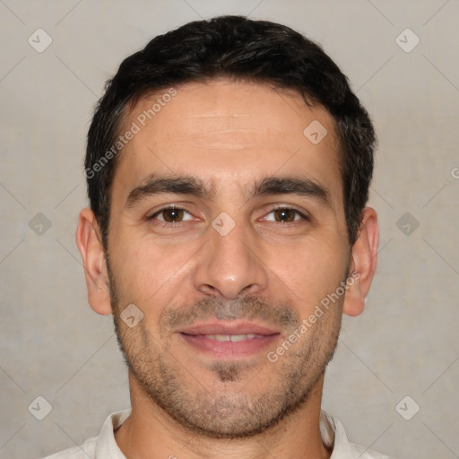 Joyful white adult male with short  black hair and brown eyes