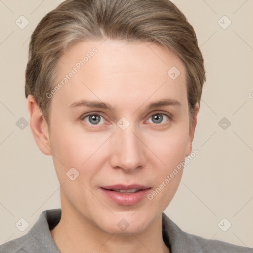 Joyful white young-adult female with short  brown hair and grey eyes