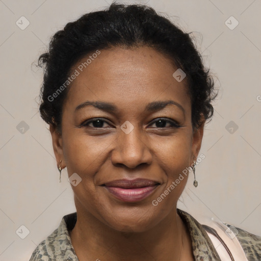 Joyful black adult female with medium  brown hair and brown eyes