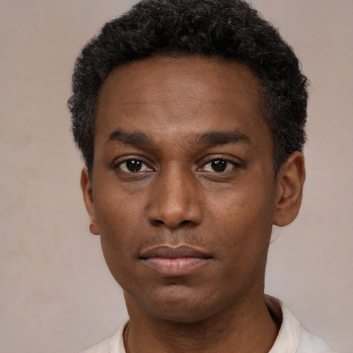 Neutral black young-adult male with short  black hair and brown eyes