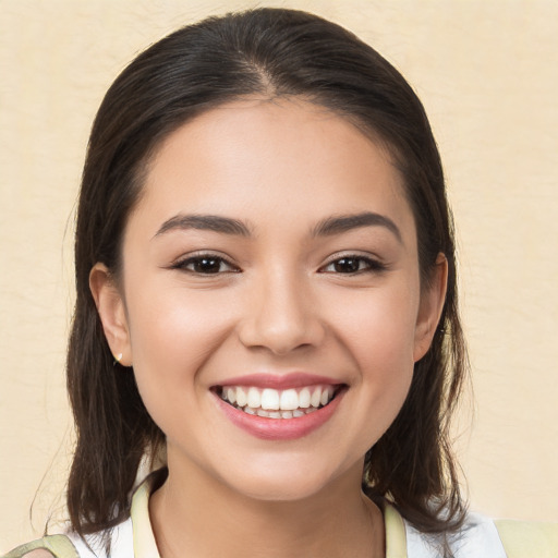 Joyful white young-adult female with medium  brown hair and brown eyes