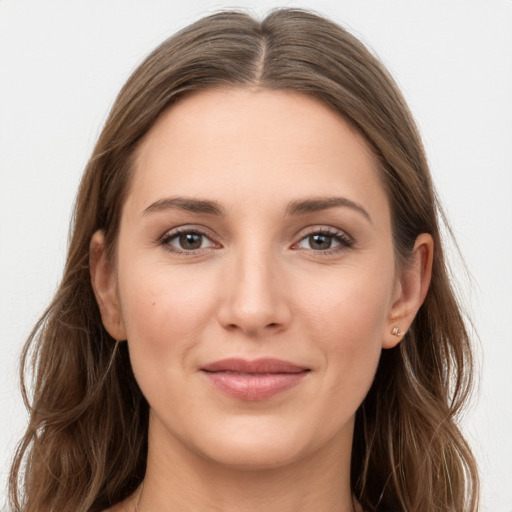 Joyful white young-adult female with long  brown hair and grey eyes