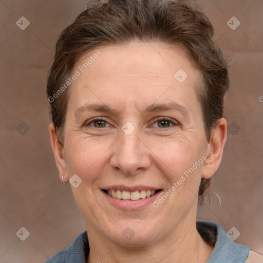 Joyful white adult female with short  brown hair and grey eyes