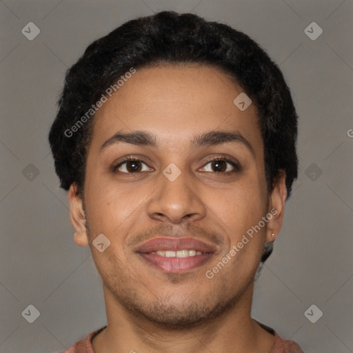 Joyful latino young-adult male with short  brown hair and brown eyes