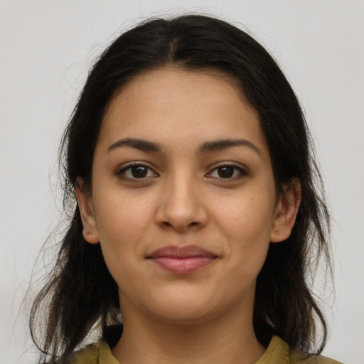 Joyful latino young-adult female with medium  brown hair and brown eyes