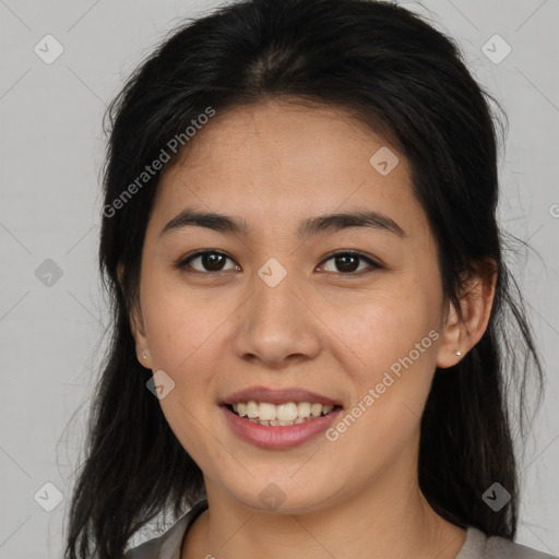 Joyful asian young-adult female with long  brown hair and brown eyes