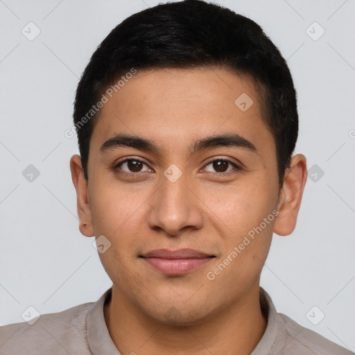 Joyful latino young-adult male with short  brown hair and brown eyes