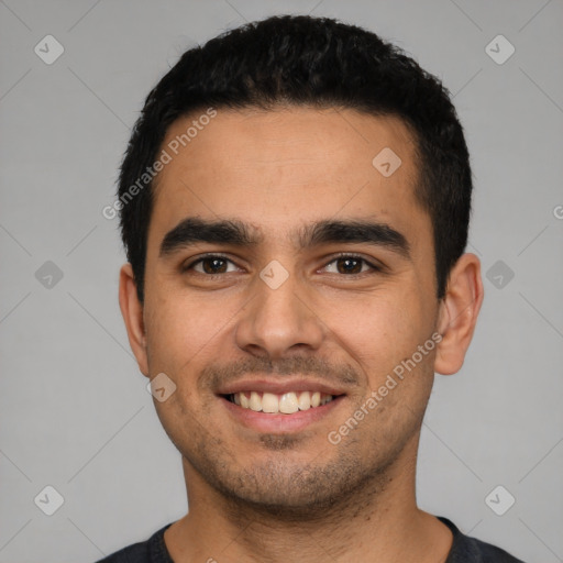 Joyful latino young-adult male with short  black hair and brown eyes