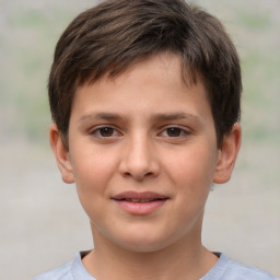 Joyful white child male with short  brown hair and brown eyes