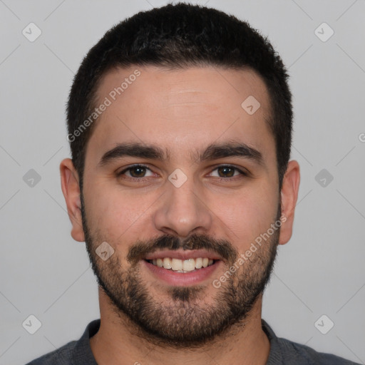 Joyful white young-adult male with short  black hair and brown eyes