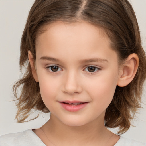 Joyful white child female with medium  brown hair and brown eyes