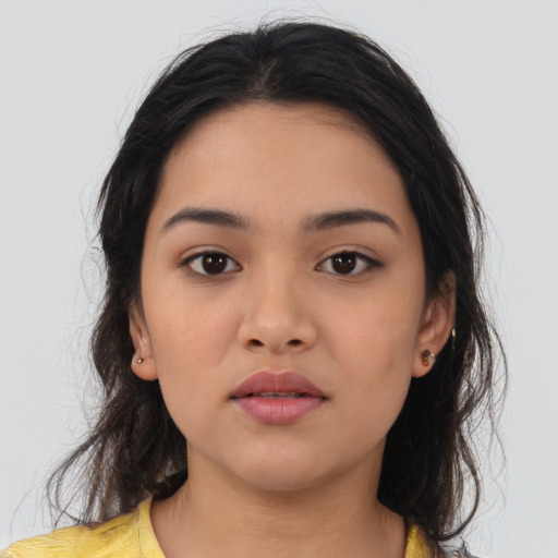 Neutral latino young-adult female with medium  brown hair and brown eyes