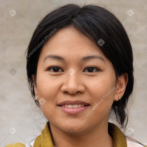 Joyful asian adult female with medium  brown hair and brown eyes