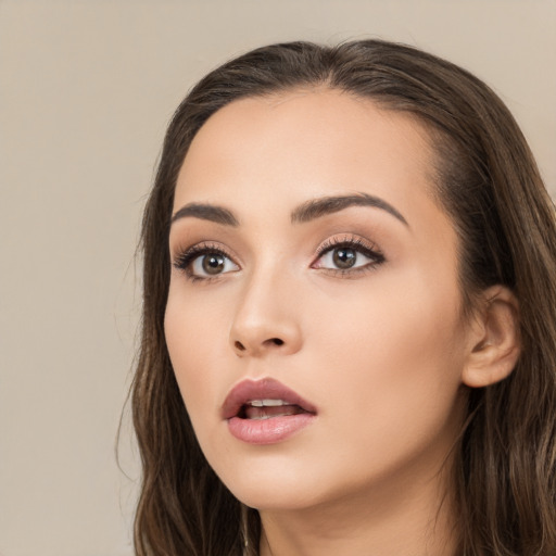 Neutral white young-adult female with long  brown hair and brown eyes