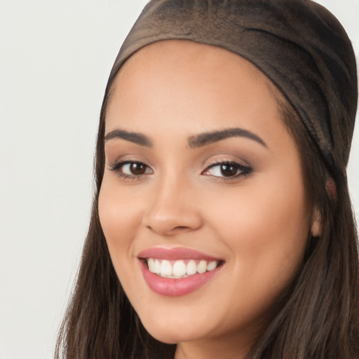 Joyful white young-adult female with long  black hair and brown eyes