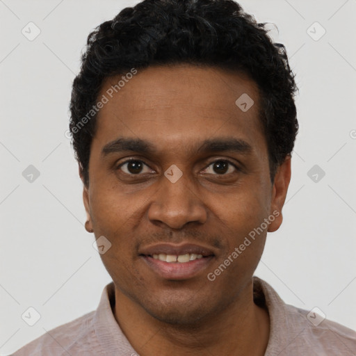 Joyful black young-adult male with short  black hair and brown eyes